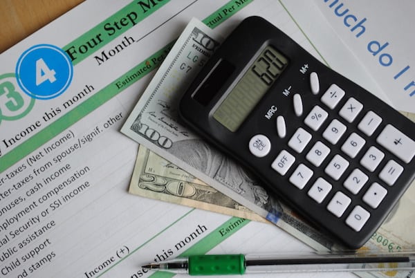 financial documents and calculator